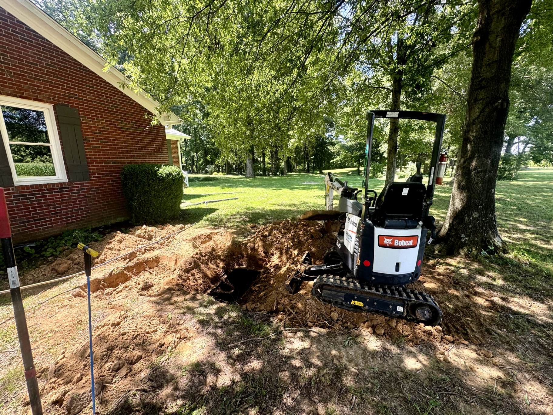 Open septic tank ready to be pumped in a rural Tennessee yard